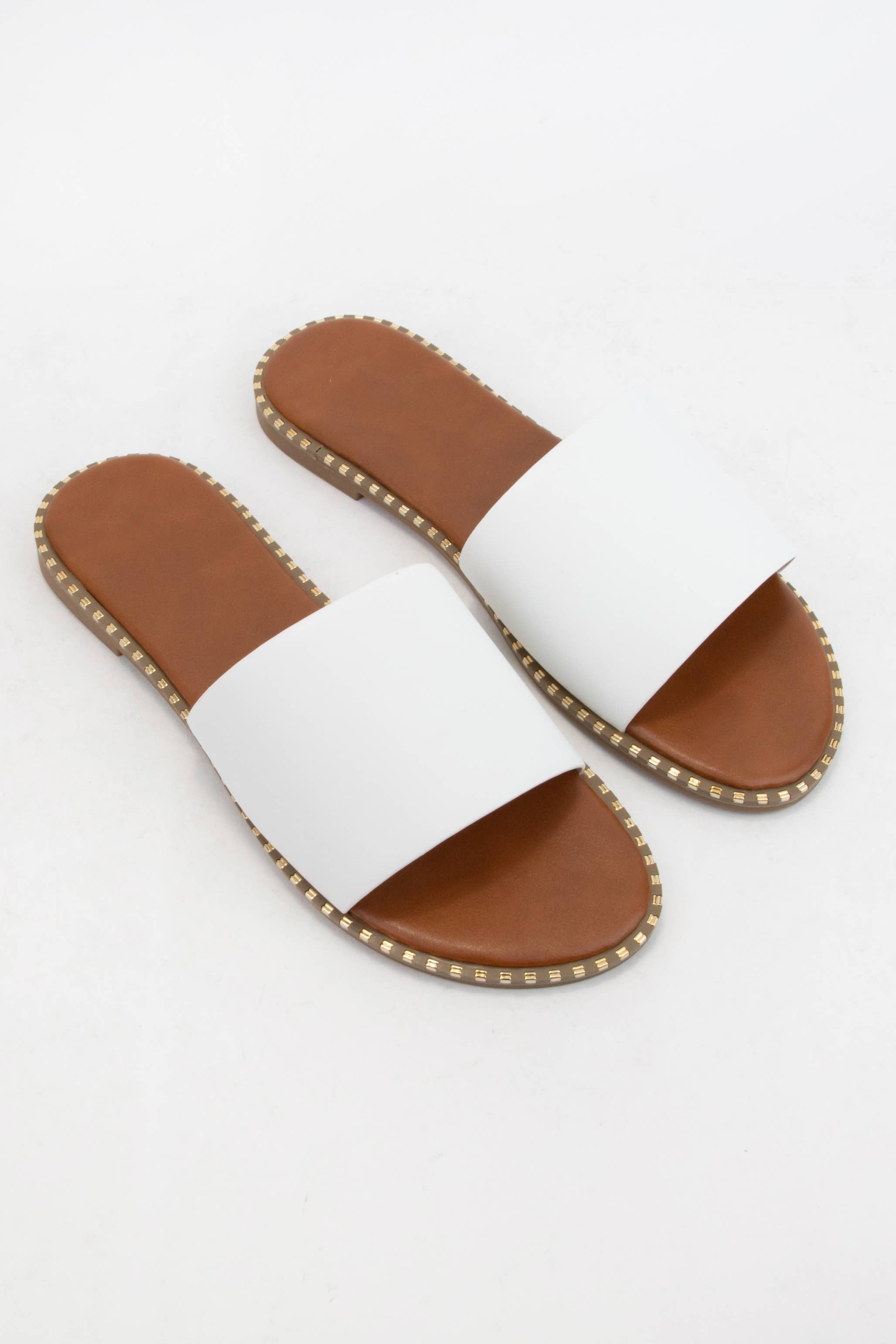 MICAH-1 METAL TIP EMBELLISHED OUTSOLE SLIDE SANDAL: NUDE