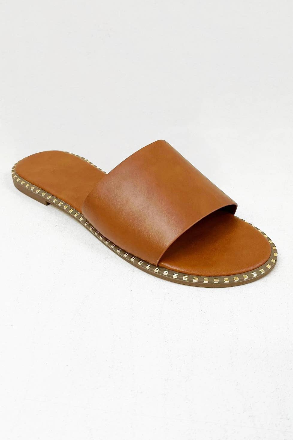 MICAH-1 METAL TIP EMBELLISHED OUTSOLE SLIDE SANDAL: NUDE