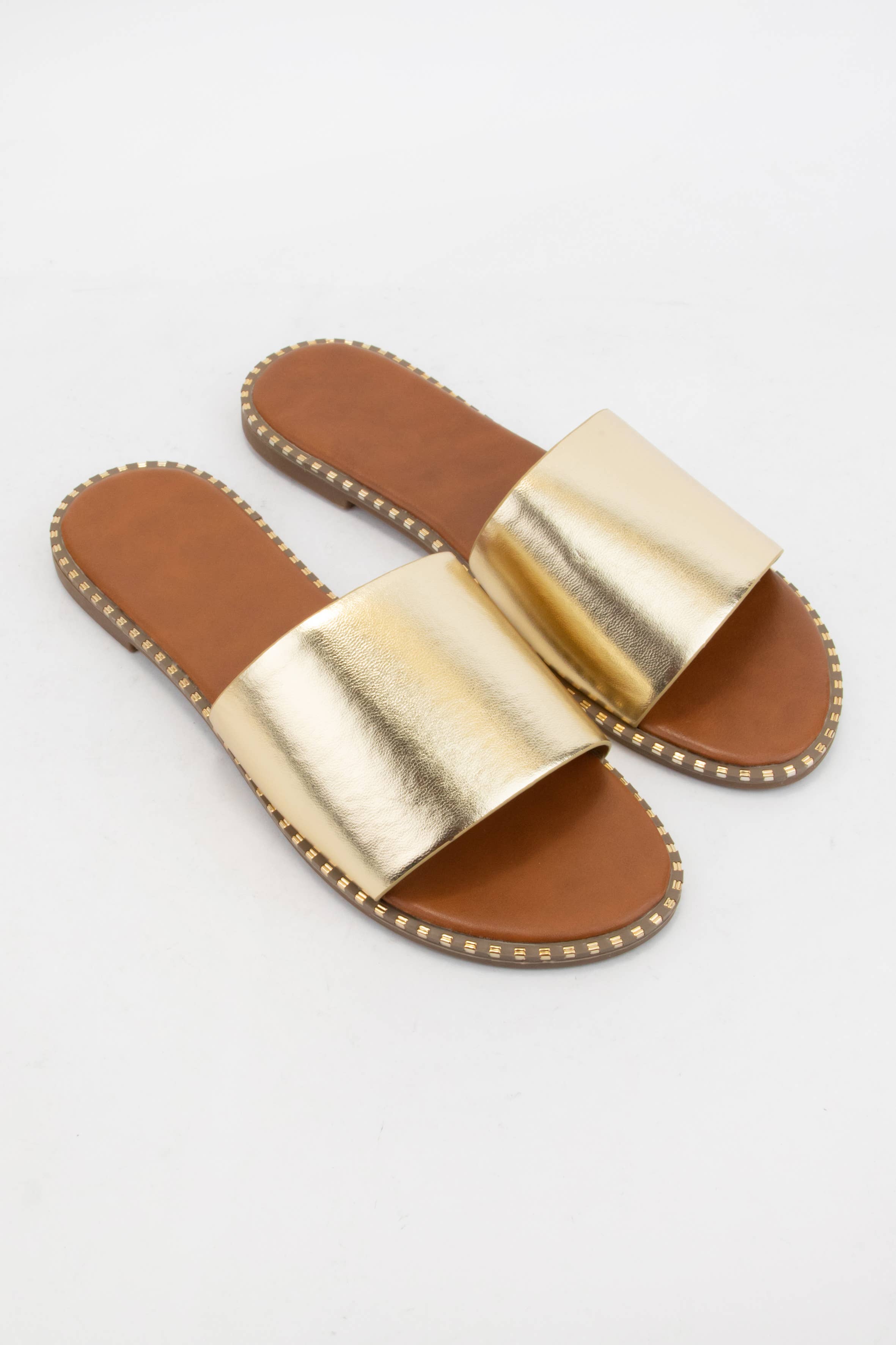 MICAH-1 METAL TIP EMBELLISHED OUTSOLE SLIDE SANDAL: NUDE